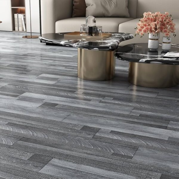 Modern living room featuring wooden flooring, decorative coffee tables, and a sofa